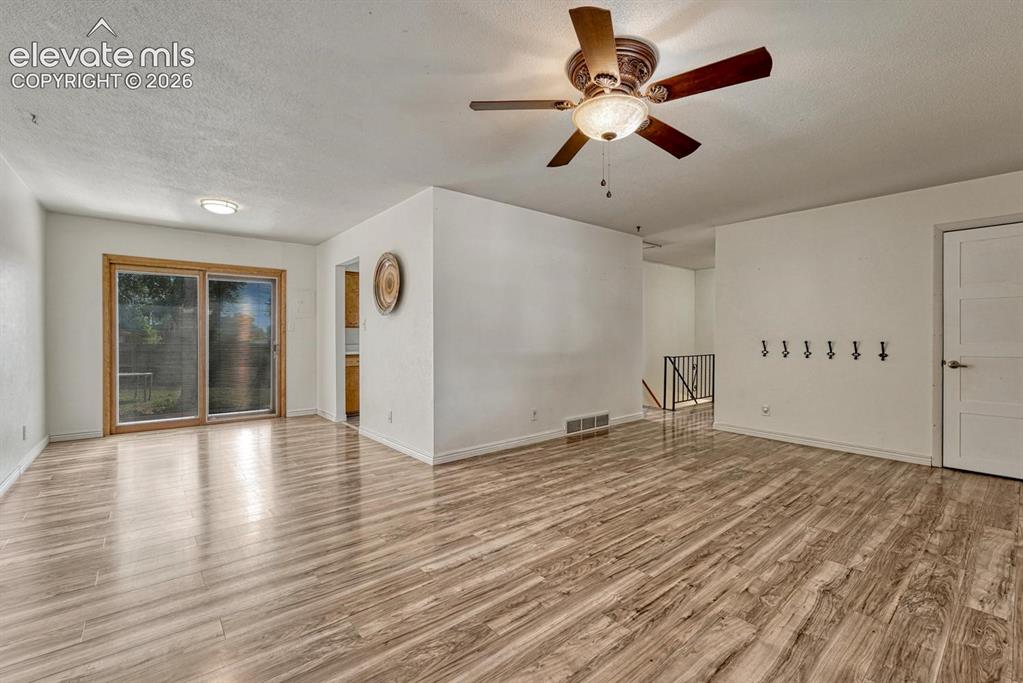 Image 10 of 50: Living room looking in dining room