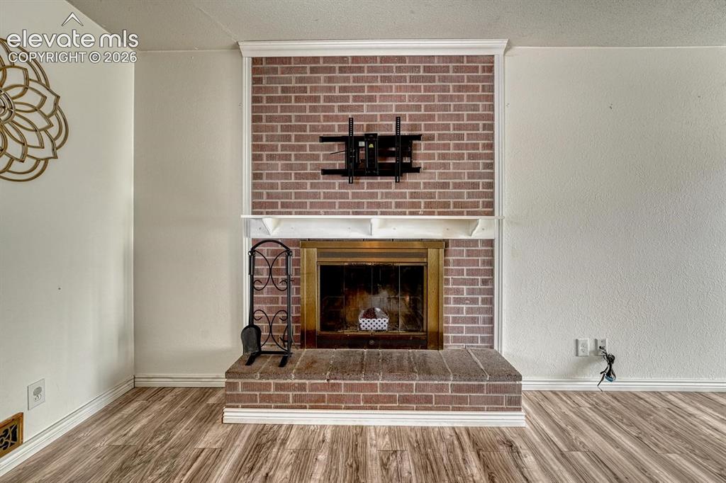 Image 9 of 50: Wood burning fireplace