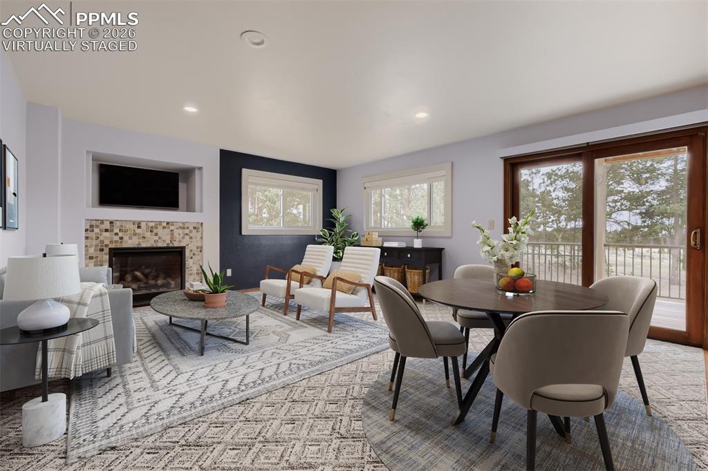 Image 11 of 48: Virtually staged family room with breakfast nook and deck access.