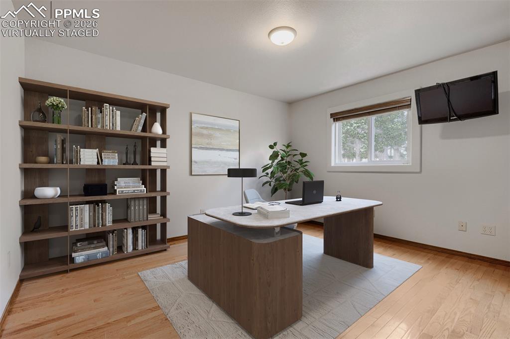 Image 19 of 48: Virtually staged main level office