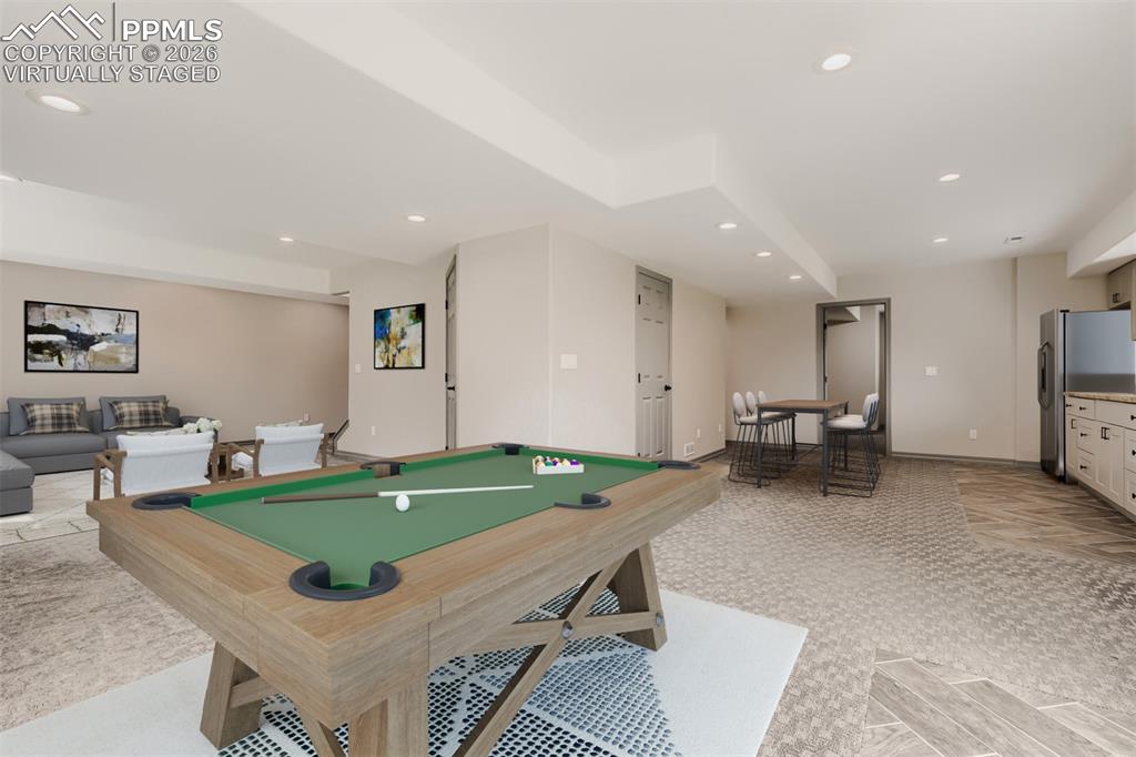 Image 35 of 48: Virtually staged game room.