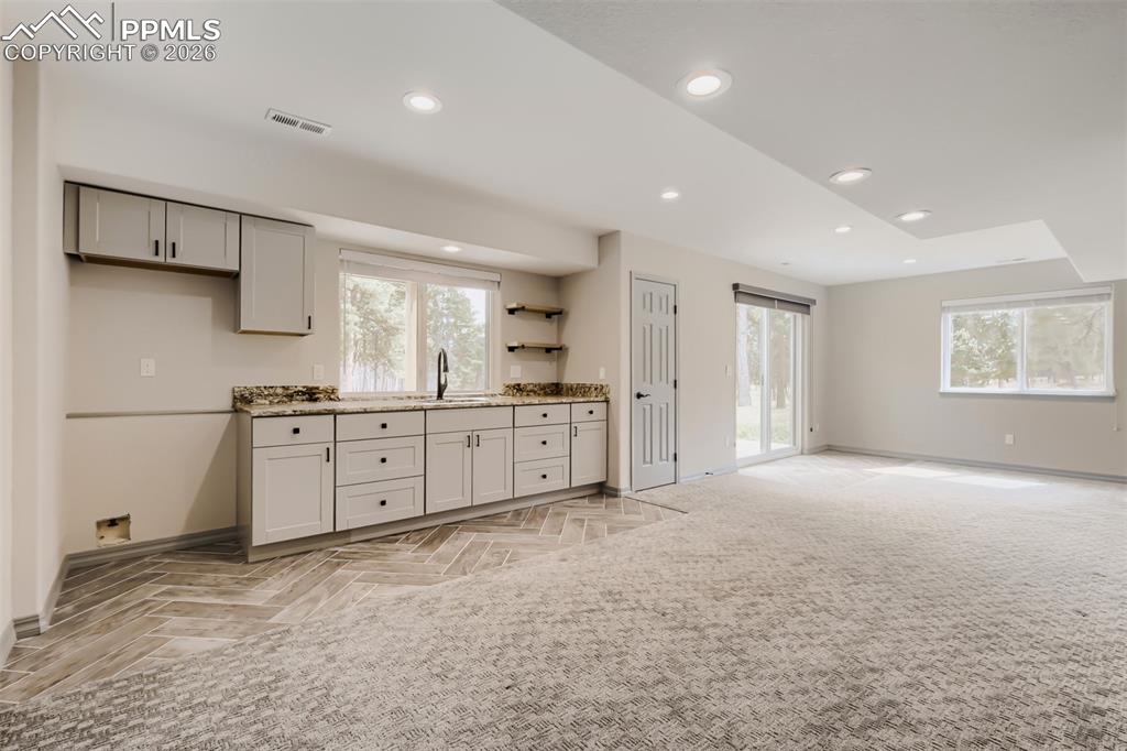 Image 38 of 48: Wet bar and game room