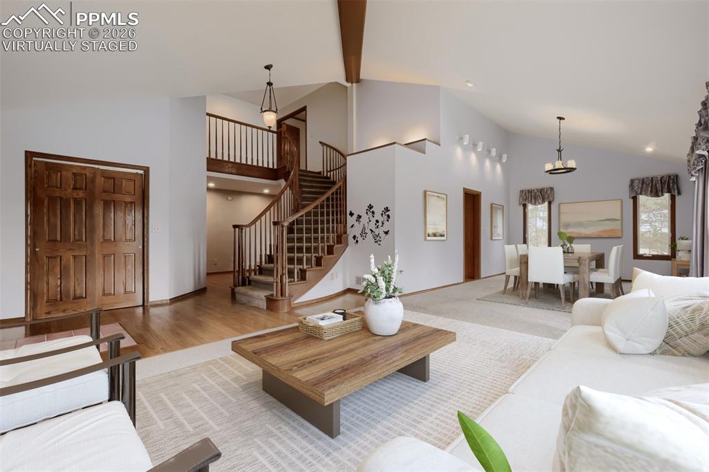 Image 7 of 48: Virtually staged formal living and dining rooms.