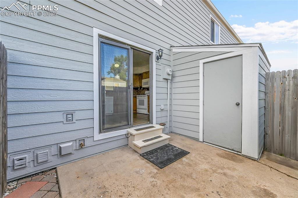 Image 7 of 12: Entrance to property with a patio
