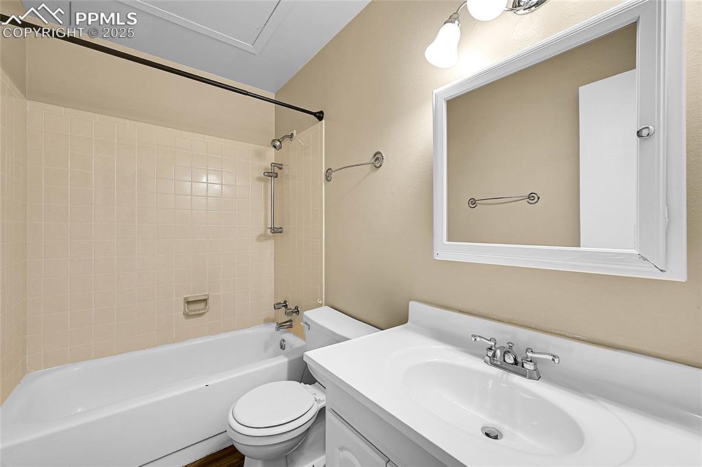 Image 8 of 12: Full bath featuring bathing tub / shower combination and vanity