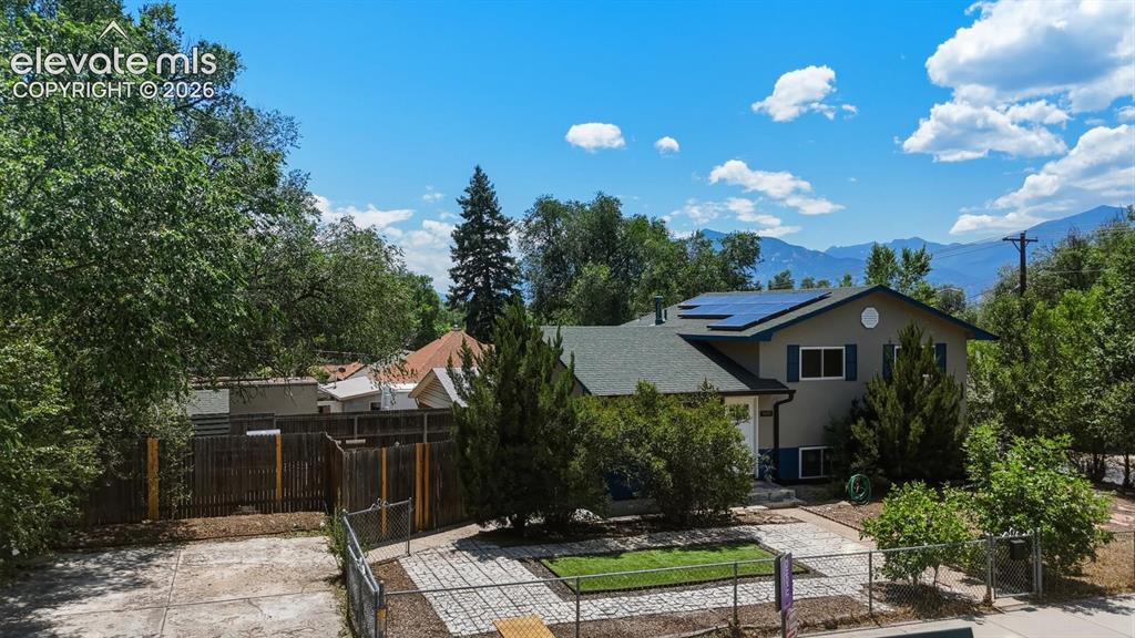 Image 1 of 48: beautifully updated 4-bedroom, 2-bath tri-level home on a corner lot in the