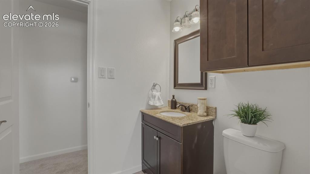 Image 12 of 48: Upper Level Full Bathroom with vanity and framed mirror.