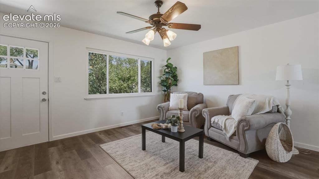 Image 19 of 48: The Living Room has beautiful bamboo flooring and front yard views.