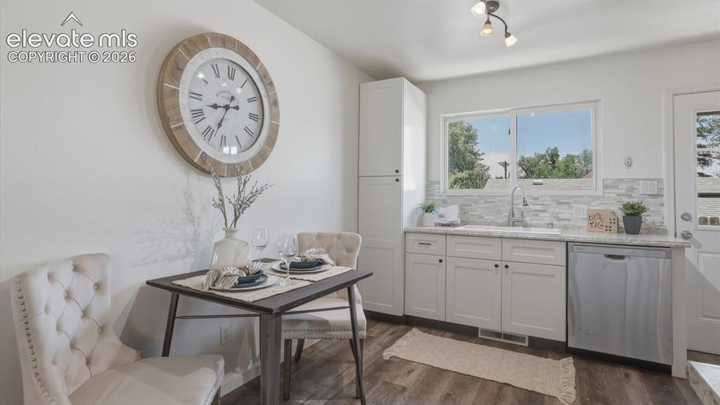 Image 22 of 48: The Dining Area and Kitchen have bamboo flooring.