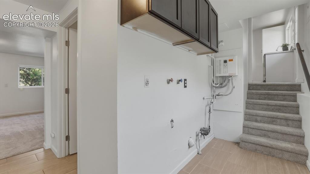 Image 26 of 48: Lower Level Laundry area with hookups for a washer and dryer.