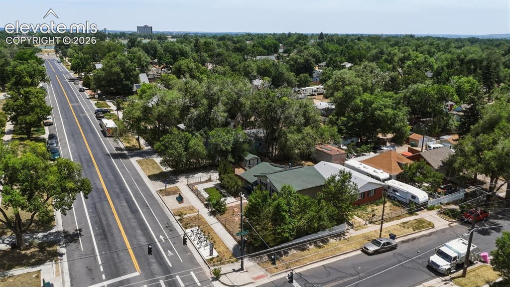 Image 39 of 48: Aerial view of home and corner lot.