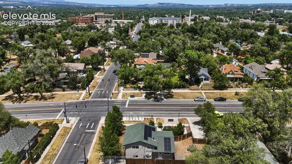 Image 45 of 48: Rear aerial view of home and lot.