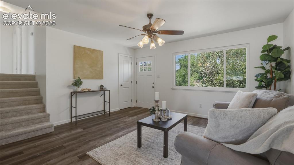Image 8 of 48: The bright living room is filled with natural light and includes a ceiling