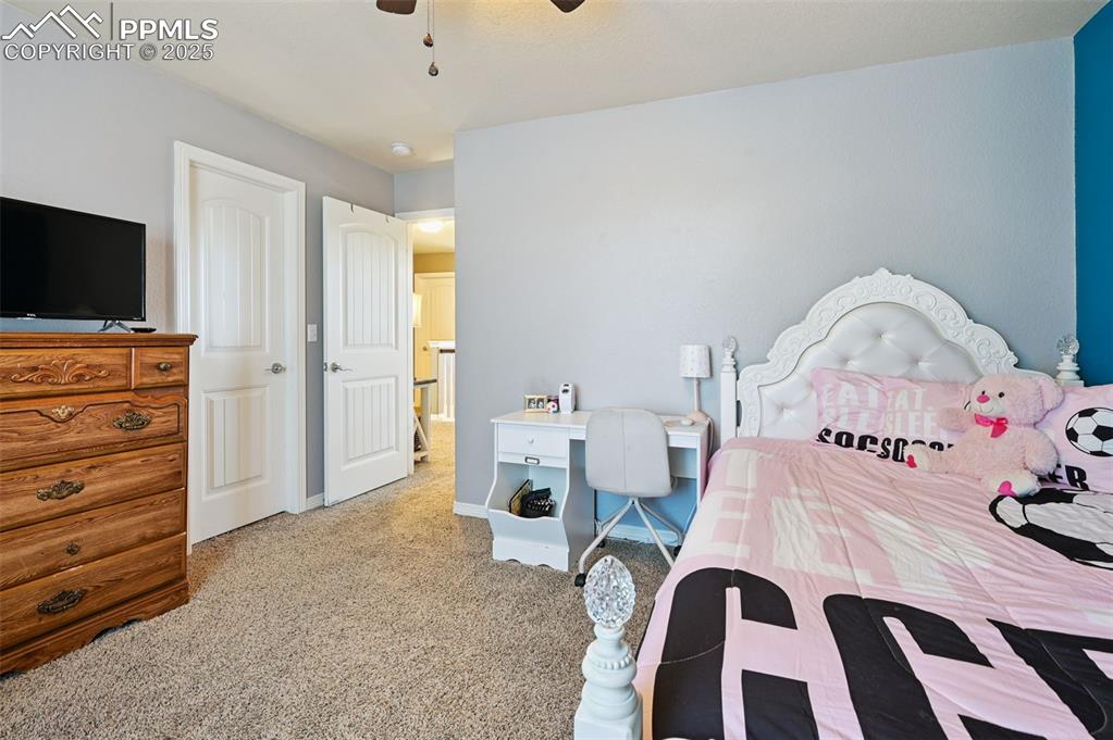 Image 30 of 39: Bedroom with light carpet, a closet, and ceiling fan