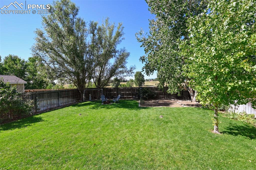 Image 36 of 39: View of fenced backyard