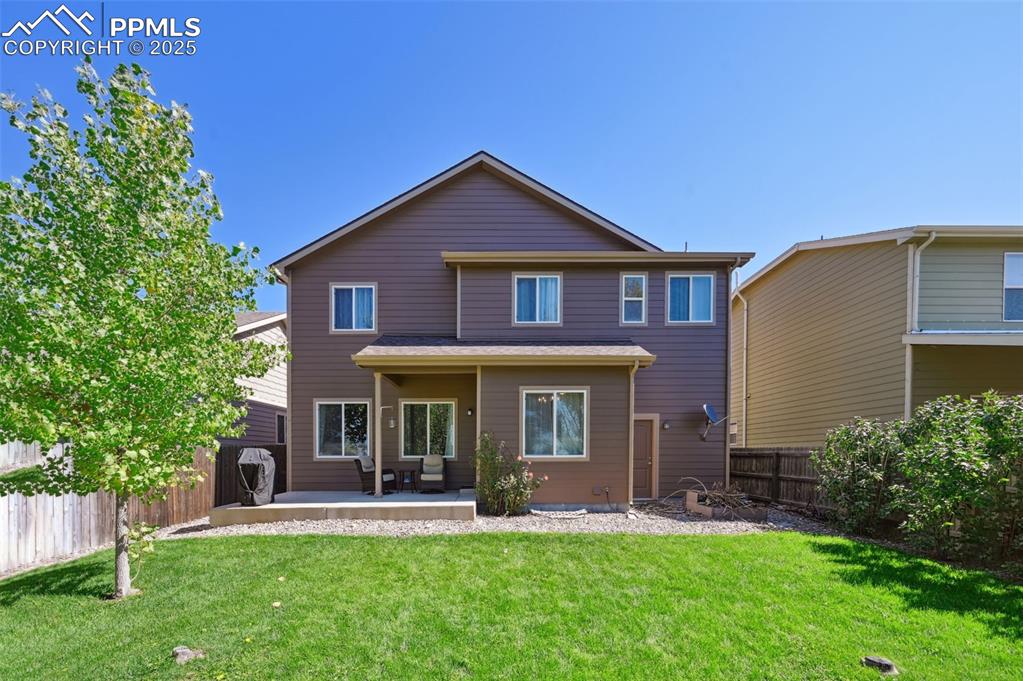 Image 38 of 39: Rear view of property with a fenced backyard and a patio