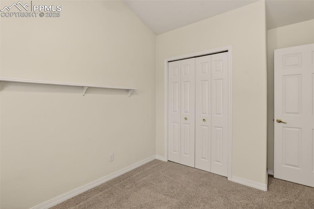 Image 25 of 33: Upstairs bedroom