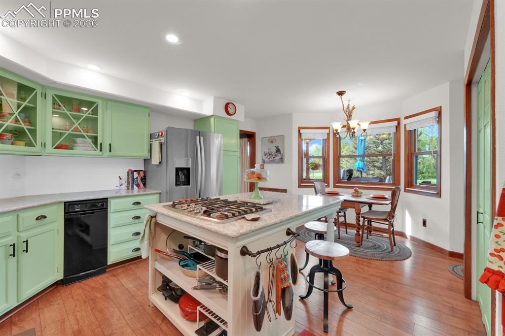 Image 11 of 42: Kitchen with Cambria quartz counter tops and updated appliances