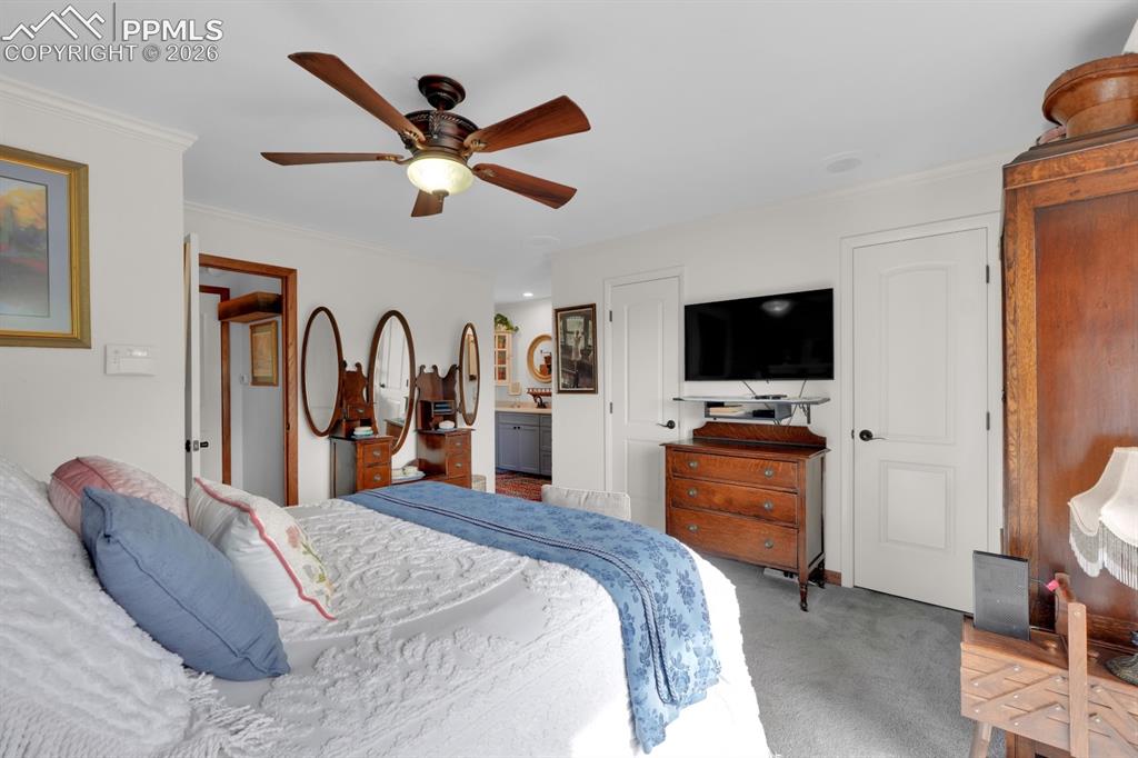 Image 18 of 42: Primary bedroom w/ ensuite bathroom