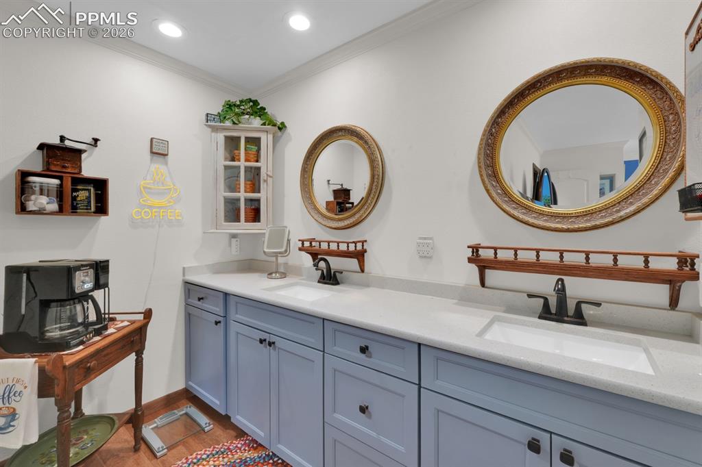 Image 19 of 42: Primary bathroom with double vanity and Quartz counter tops