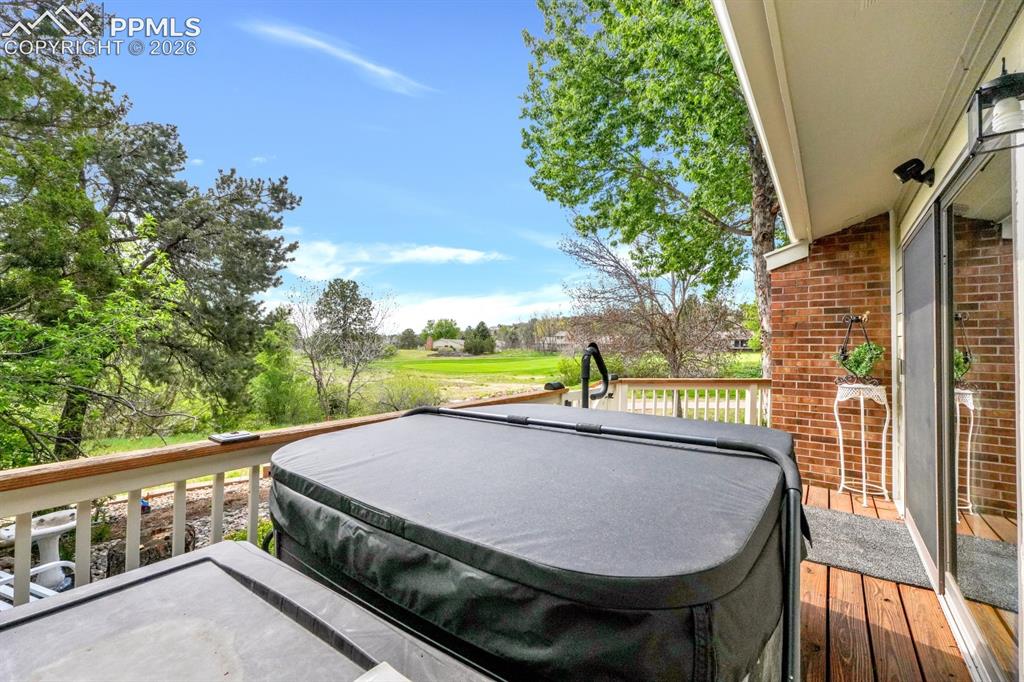 Image 29 of 42: Deck with hot tub