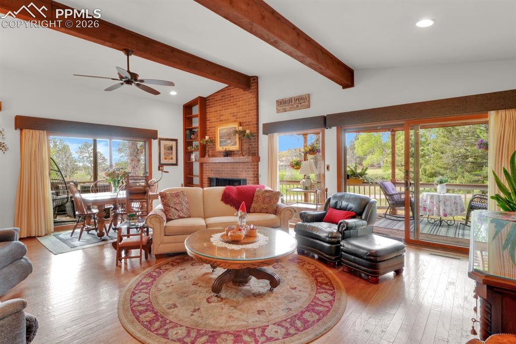 Image 3 of 42: Living room with walk-out to deck