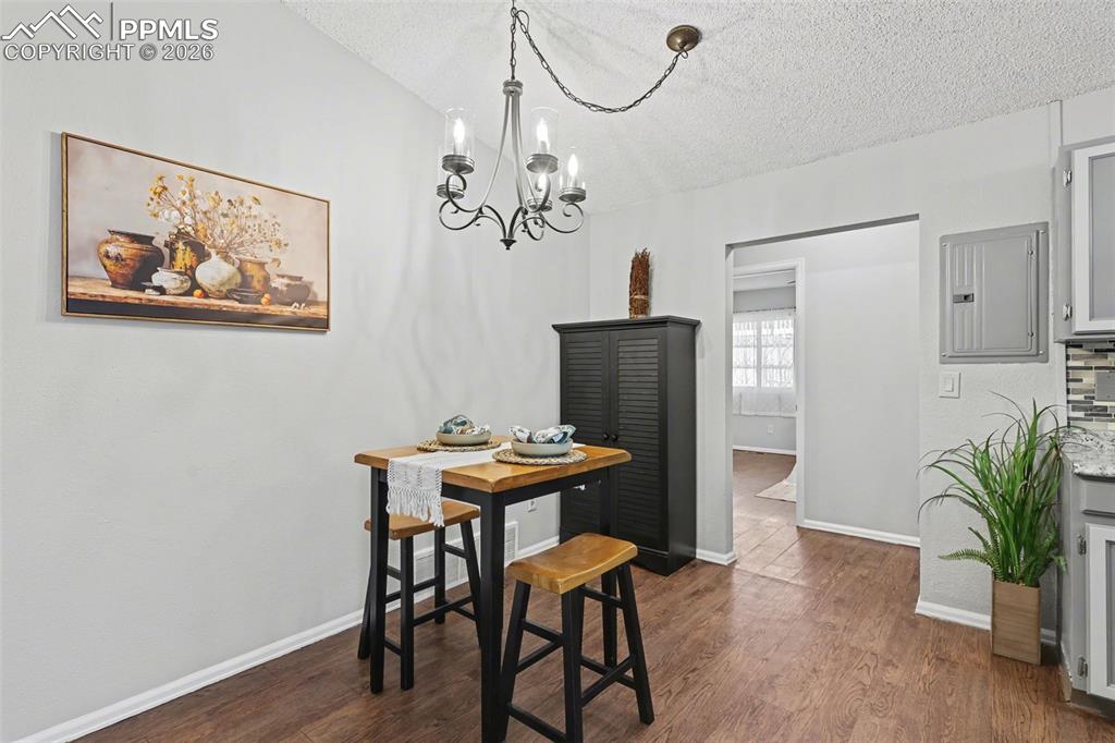 Image 6 of 31: Dining area with view of Primary bdrm in the middle