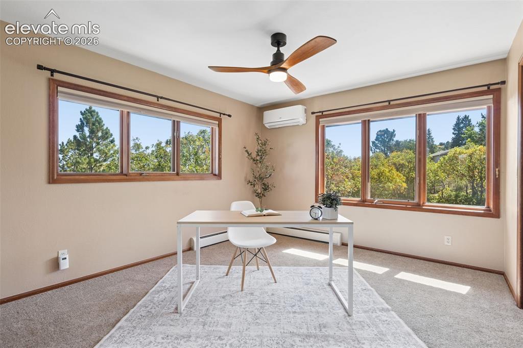 Image 27 of 50: Dual pane windows, wood window frames, ceiling fan, split unit air conditio