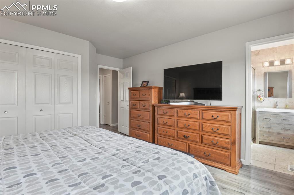 Image 13 of 31: Primary bedroom with ensuite bathroom and nice closet space