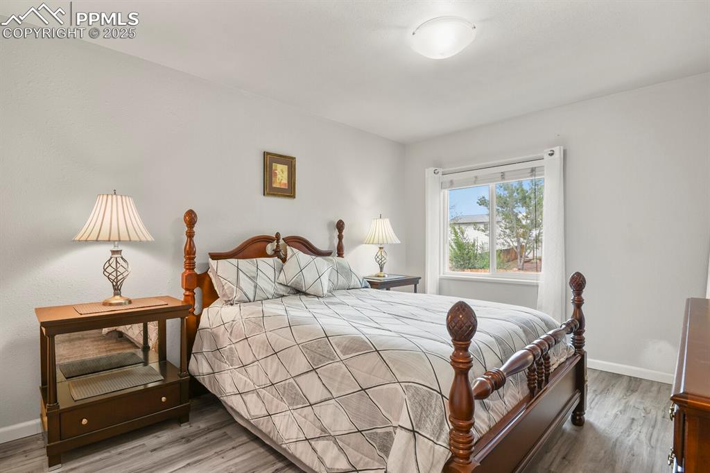 Image 17 of 31: Second bedroom with a nice sized window