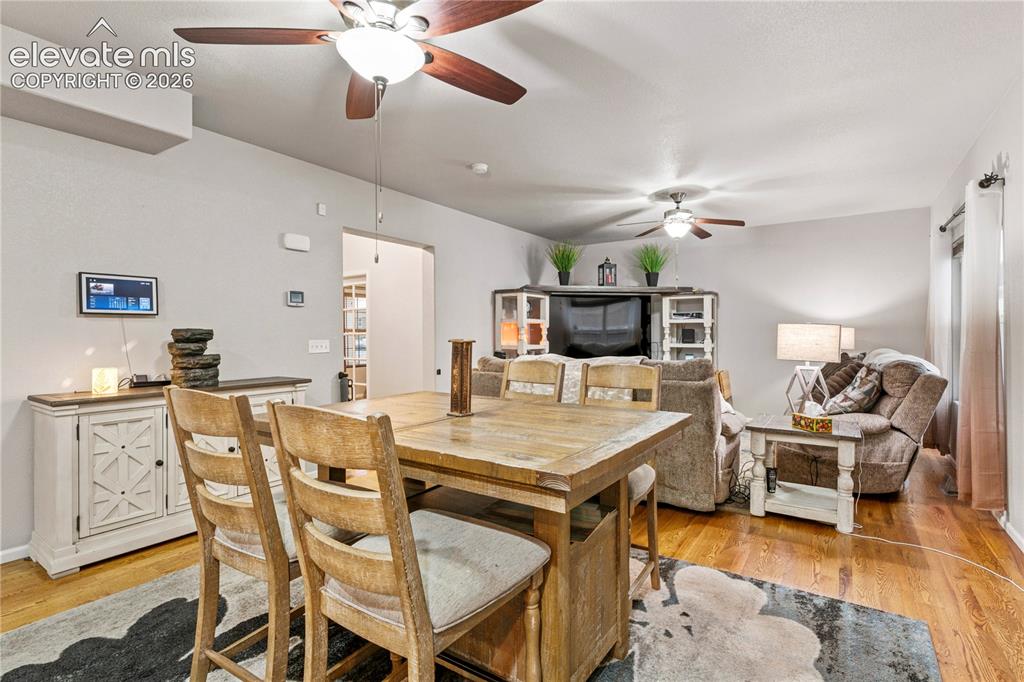 Image 11 of 43: Kitchen/dining area opens up to the spacious living room