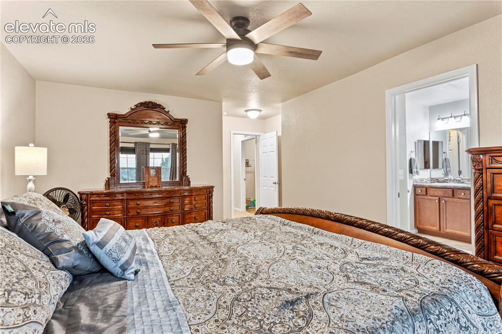 Image 18 of 43: Primary bedroom has its own private bathroom