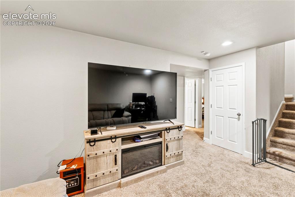 Image 26 of 43: Another view of family room in basement