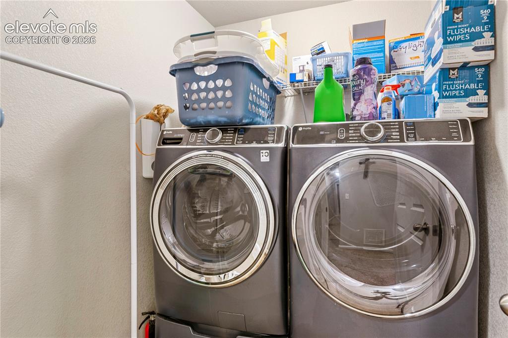 Image 28 of 43: Separate laundry room on upper level