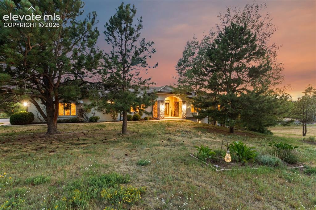 Image 1 of 50: Ranch-style exterior with stone accents, a covered entry, and multiple wind