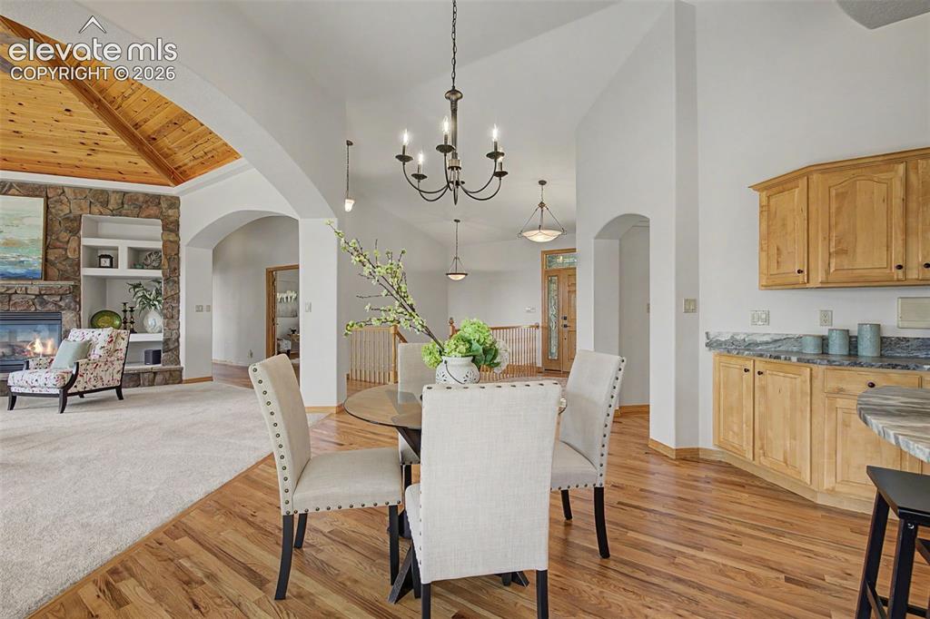 Image 13 of 50: Vaulted wood-paneled ceiling with exposed beams