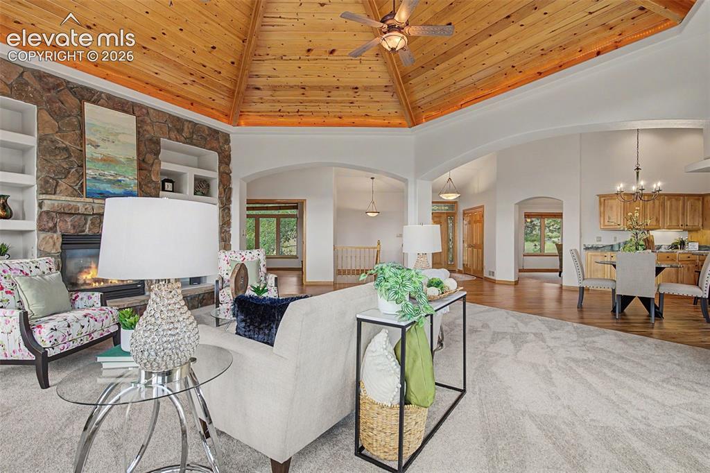 Image 15 of 50: Vaulted wood-paneled ceiling with ceiling fan