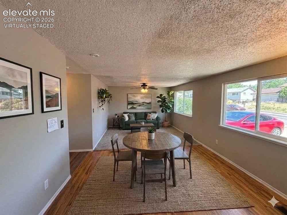 Image 2 of 21: Virtually staged Dining room and Living room