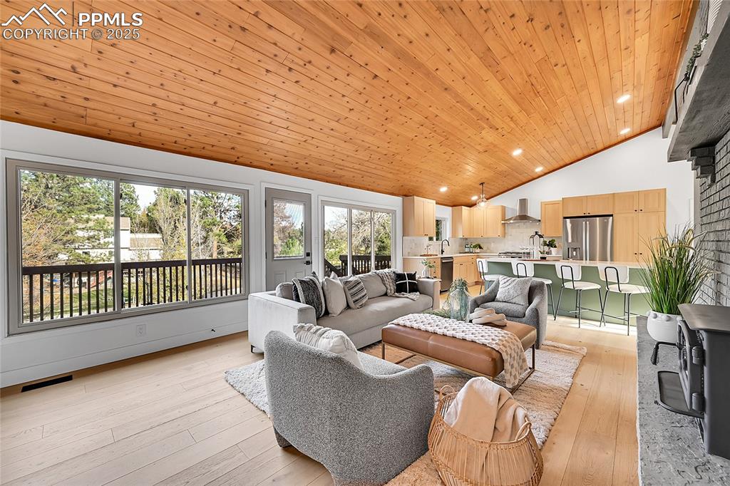 Image 20 of 40: Living room featuring recessed lighting, light wood-style floors, wooden ce