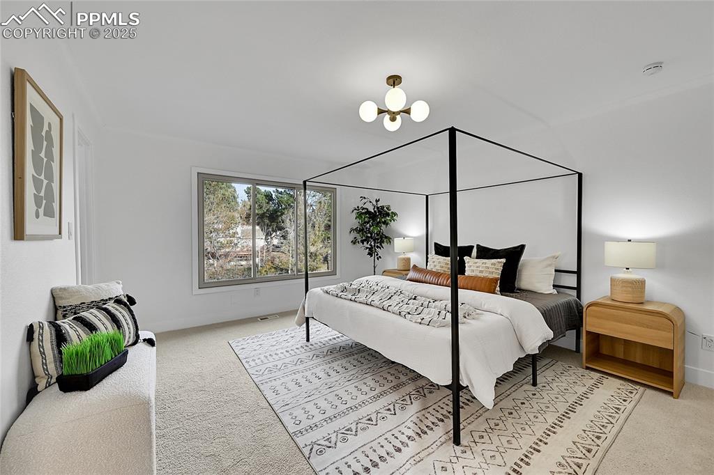 Image 22 of 40: Bedroom featuring light carpet