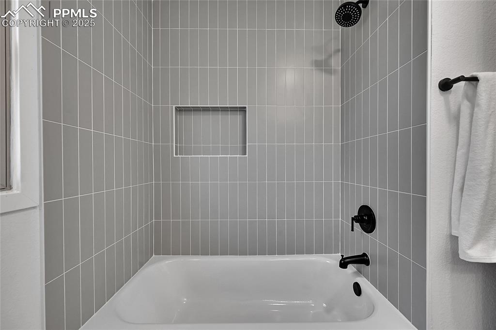 Image 29 of 40: Full bath featuring shower / washtub combination