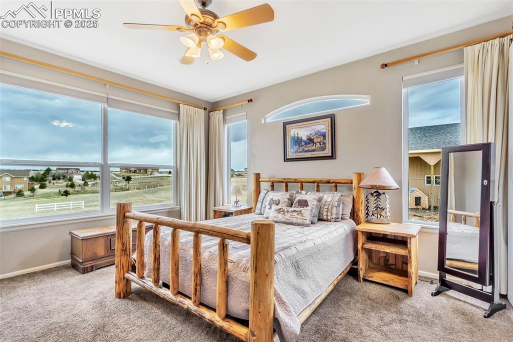 Image 21 of 50: Master bedroom w/ Pikes Peak Views