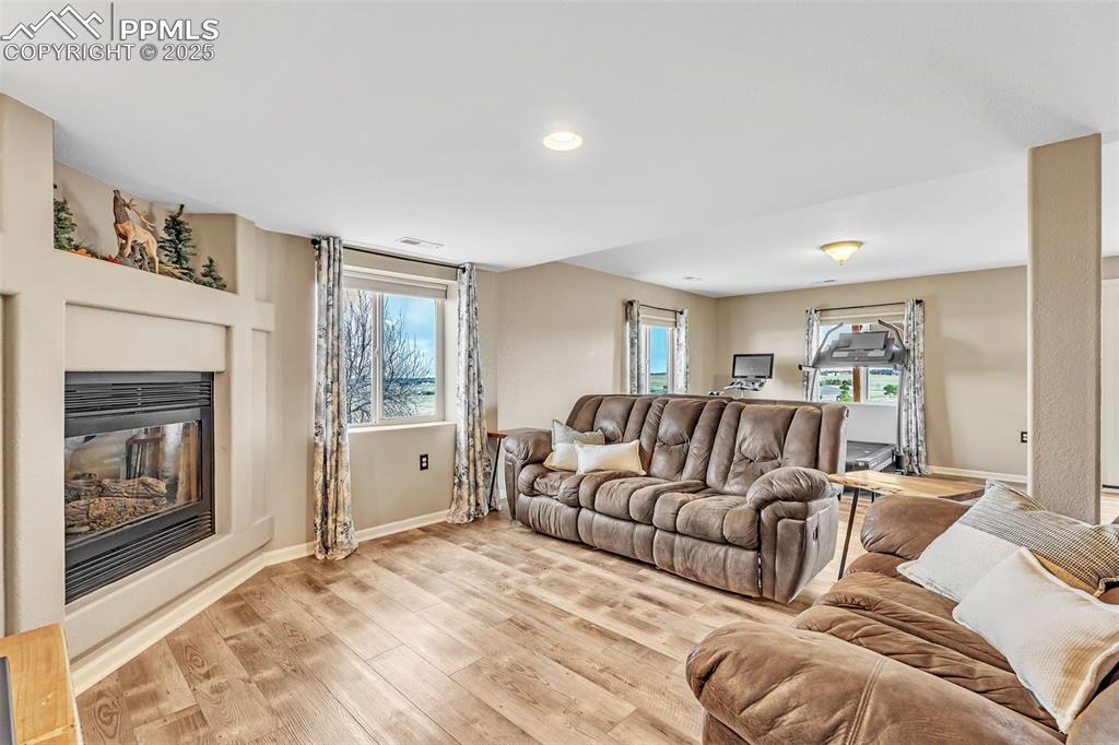 Image 32 of 50: Walk Out Level Family Room To Stamped Concrete Patio