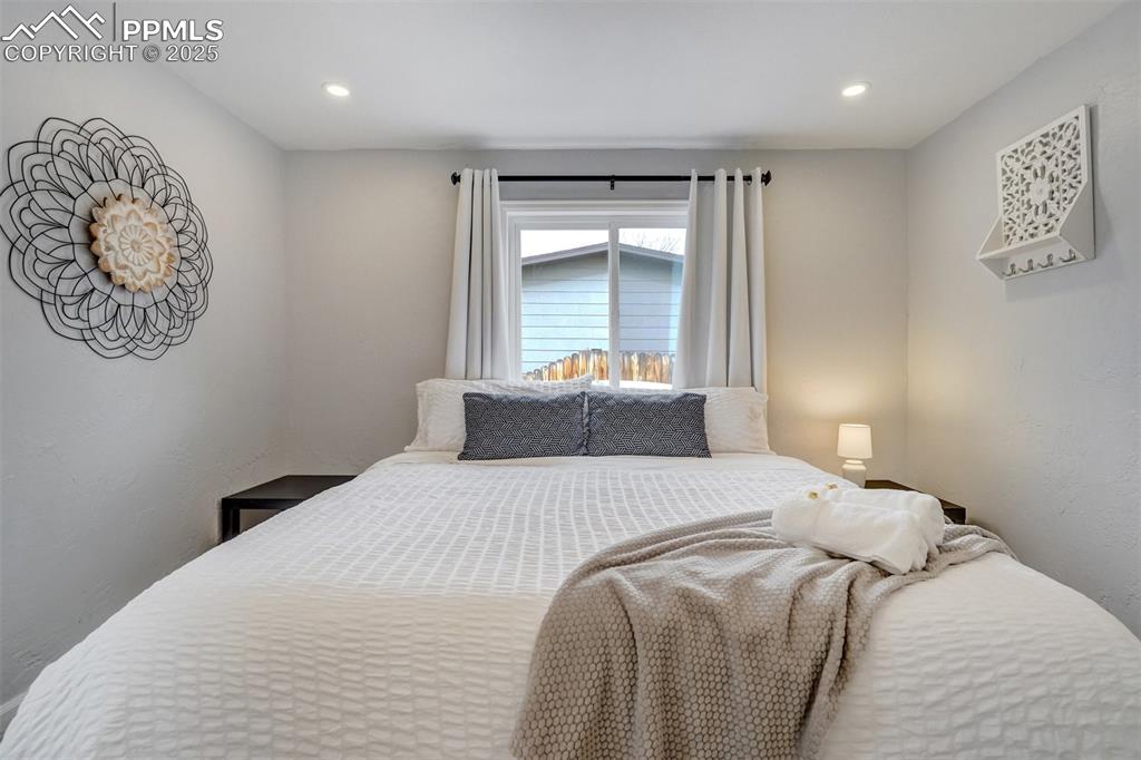 Image 13 of 31: Bedroom featuring recessed lighting