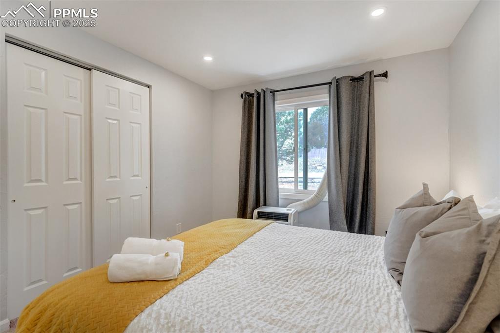 Image 17 of 31: 3rd Bedroom on main level featuring a closet and recessed lighting