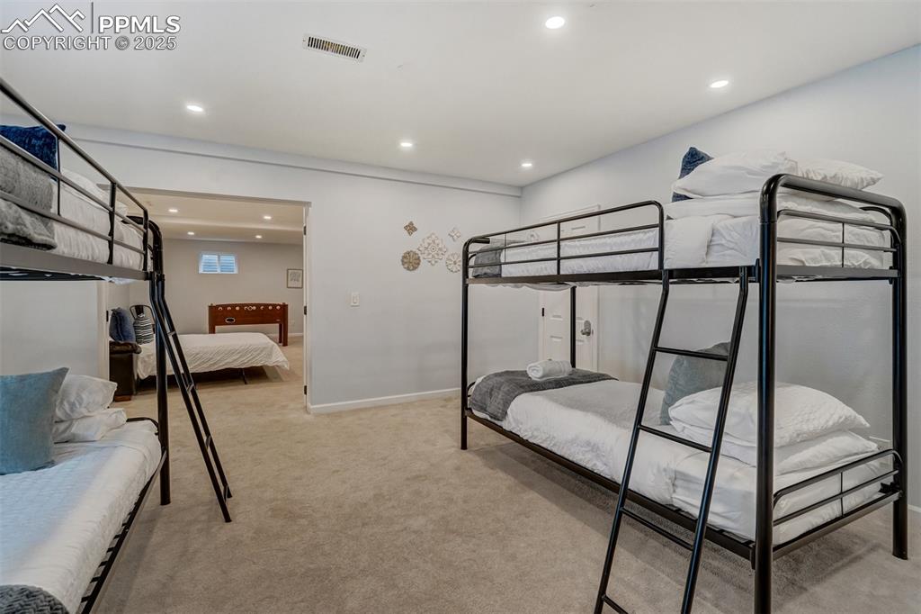 Image 22 of 31: Private entry from the outside into this walk out bedroom with recessed lig