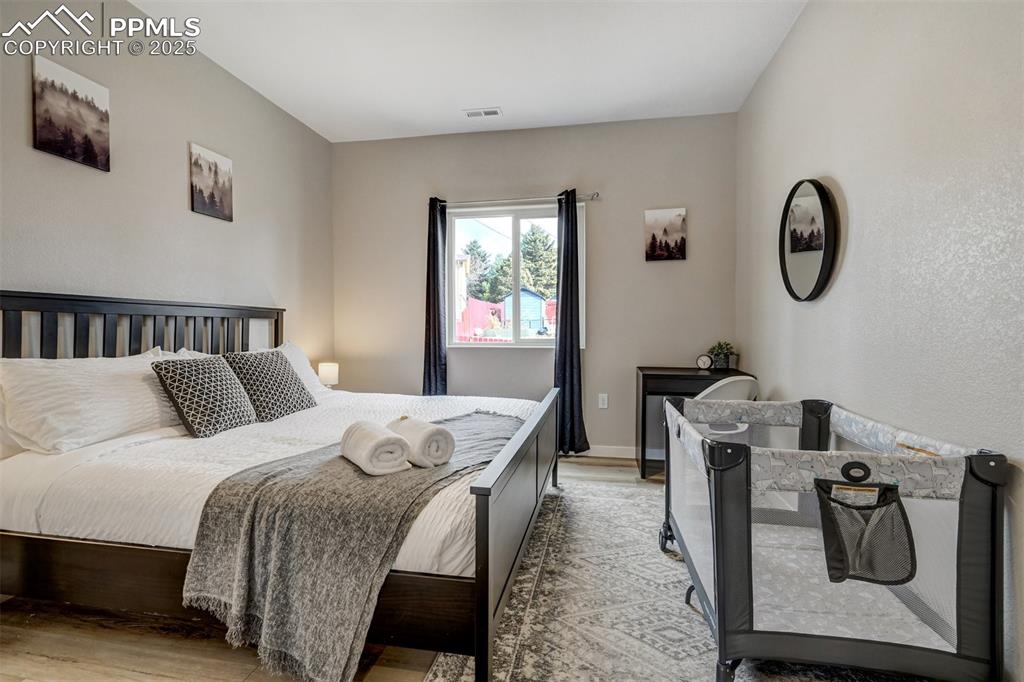 Image 29 of 31: Cottage - 2nd bedroom featuring light wood finished floors and baseboards