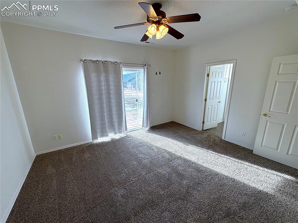 Image 11 of 49: Main Level Master Bedroom Suite