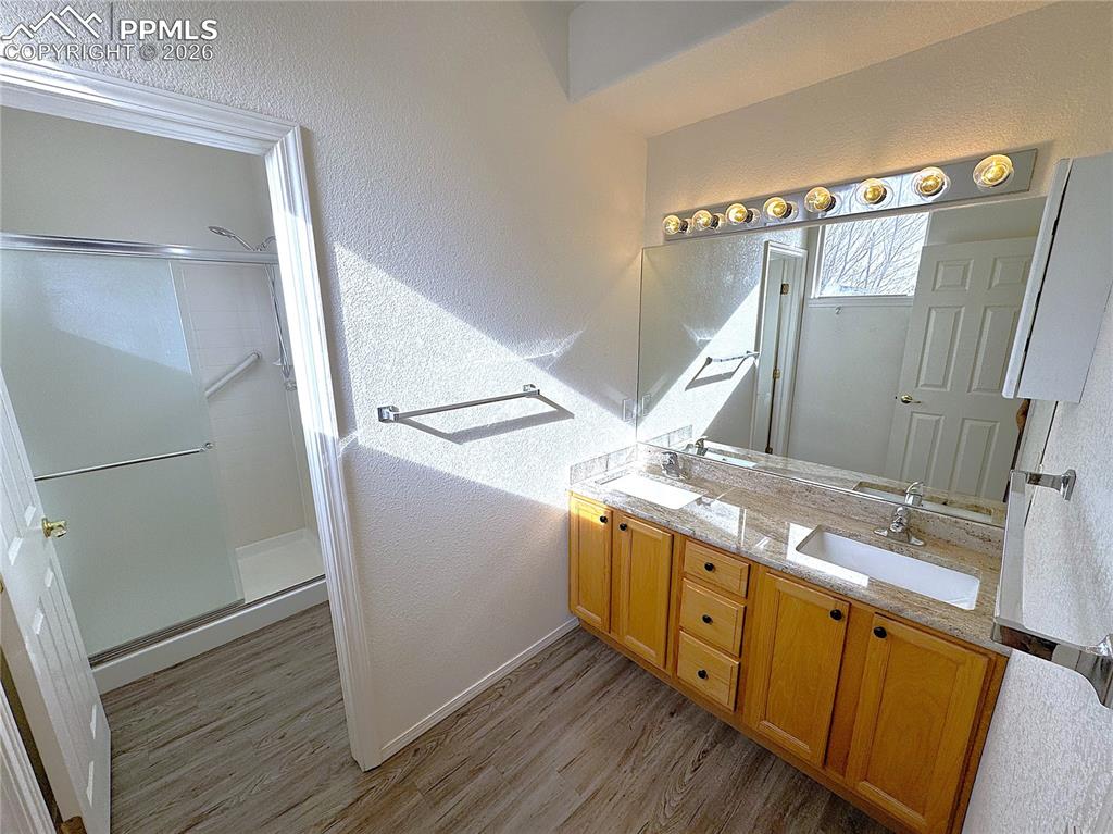 Image 13 of 49: Double Sinks, Toilet and Walk-in Shower