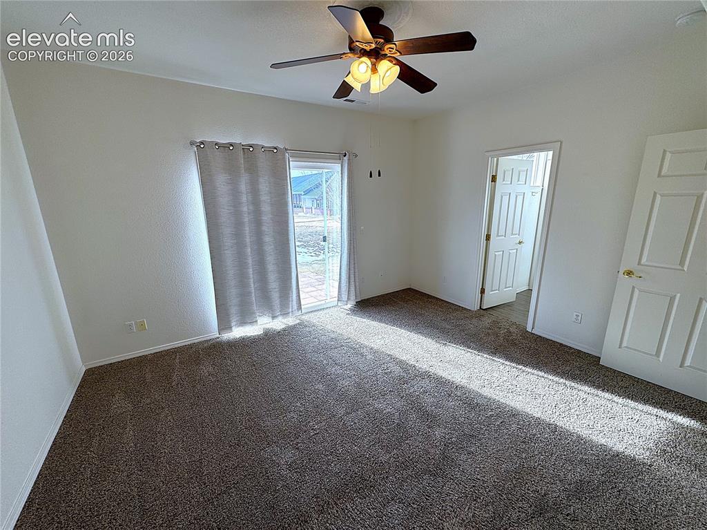 Image 13 of 49: Main Level Primary Bedroom Suite